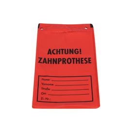 Beutel mit Aufdruck "Achtung Zahnprothese" und Beschriftungsfeld für persönliche Daten.