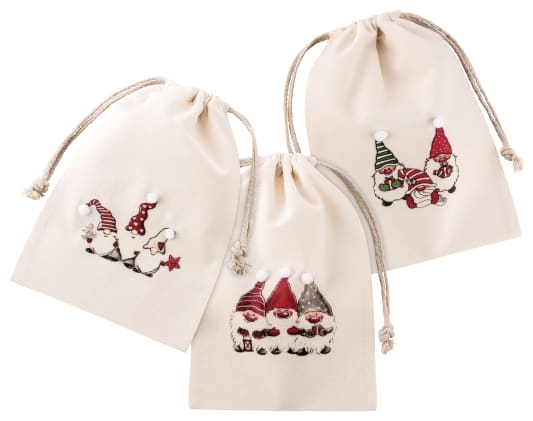 Beutel mit schönem Weihnachtsmotiv und Kordel zum Verschließen. Farbe Natur mit Elementen in Weiß, Rot und Blau. Mit 3D-Bommel.  
␍
␍In drei Ausführungen erhältlich (Lieferung erfolgt unsortiert). Bild 1